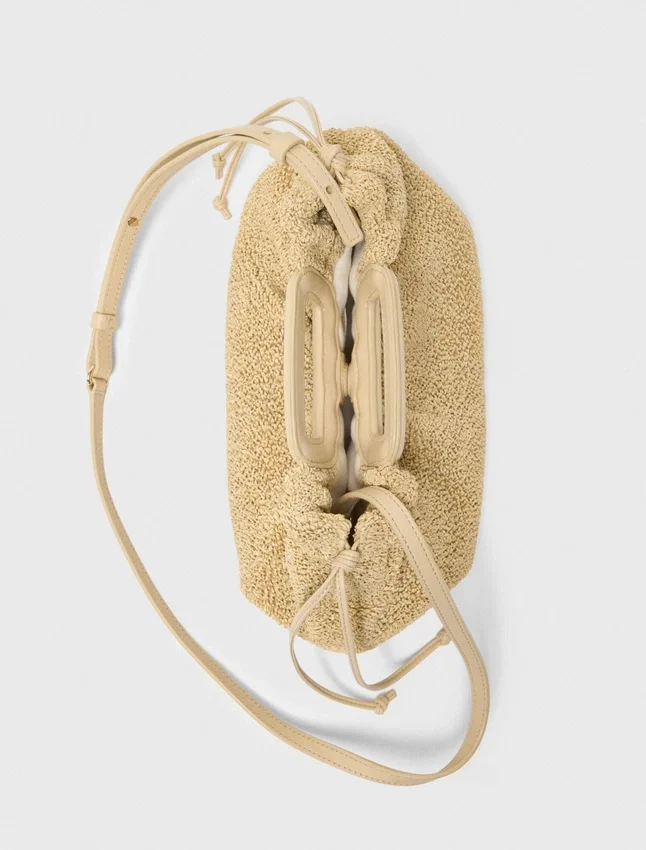 Mipli bouclé effect clutch bag Mipli bouclé effect clutch bag