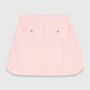 Short topstitched knit skirt
