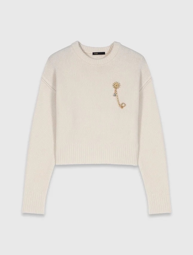 Sweater with floral brooch Sweater with floral brooch