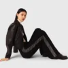 Trousers with rhinestone band