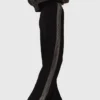 Trousers with rhinestone band