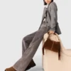 Wide-leg jeans with chain-link belt